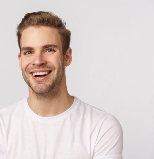 handsome-blond-guy-with-blue-eyes-white-t-shirt-smiling 1